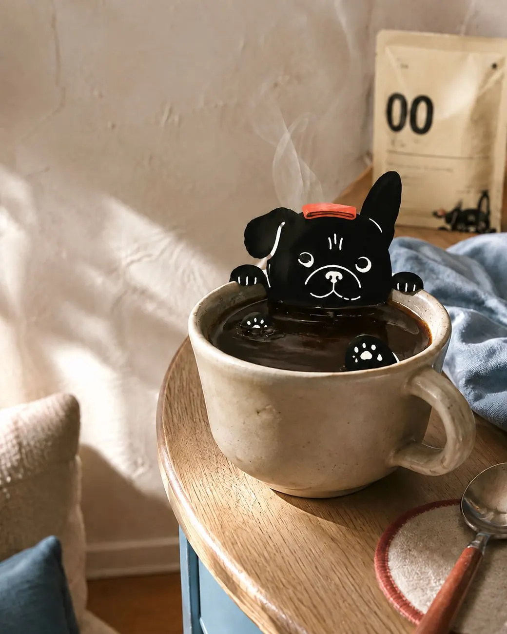 Black Dawg mascot artwork climbing out of a cup of coffee