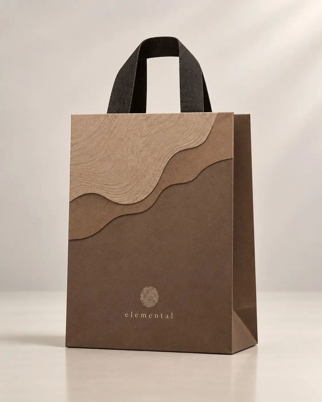 The Elemental retail bag with a tree-ring pattern across its upper half