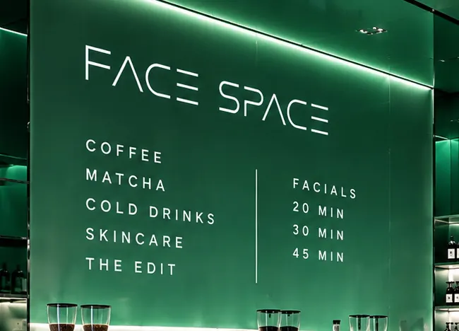 The Face Space menu wall: coffee, matcha, cold drinks, skincare and The Edit beside facials at twenty, thirty and forty-five minutes