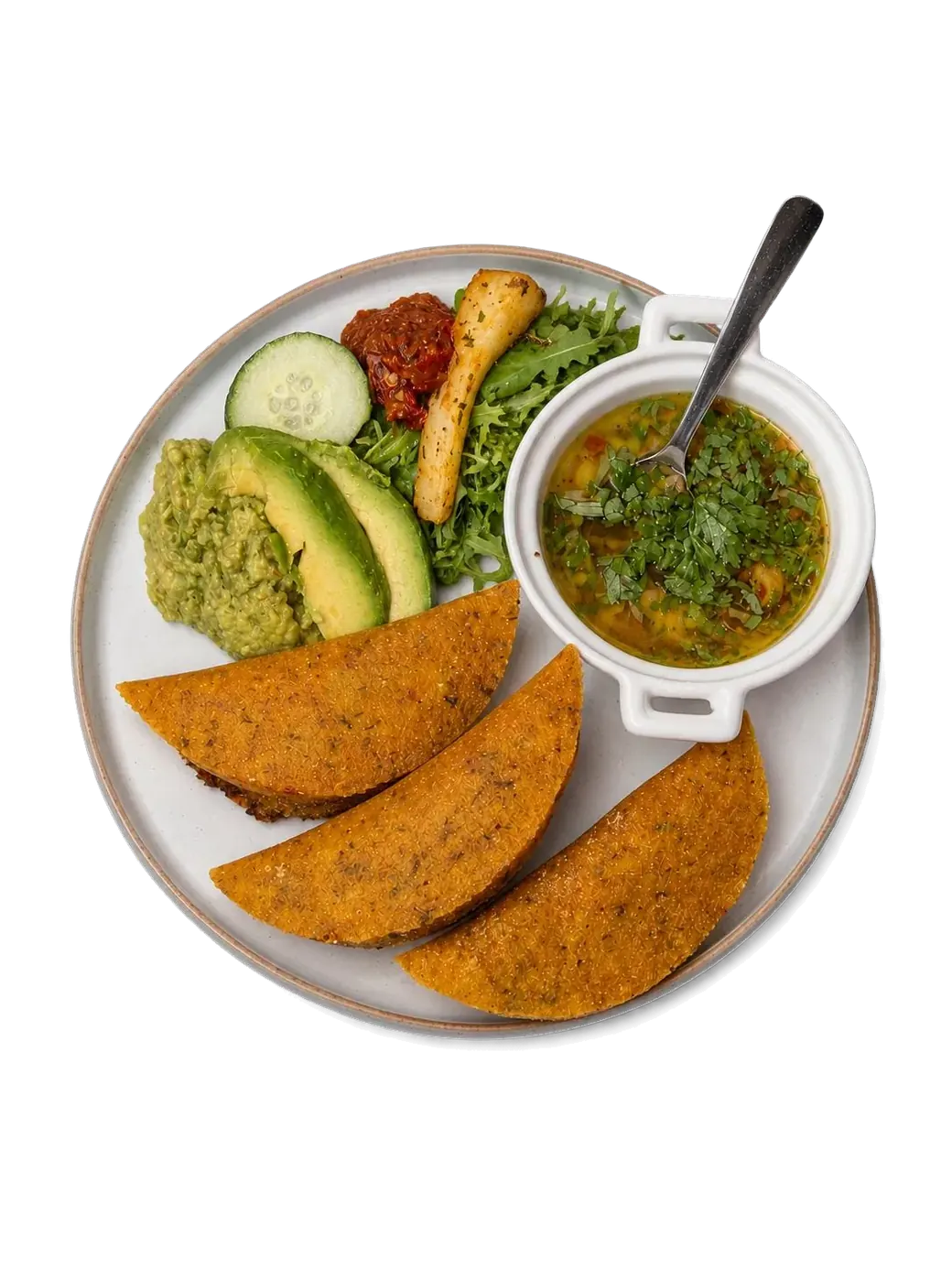 A La Velada plate: empanadas, avocado and soup with lime