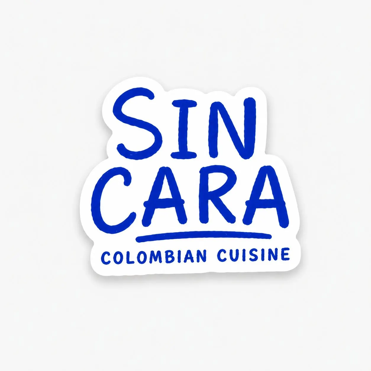 Sin Cara wordmark sticker: SIN CARA in brush lettering above Colombian Cuisine